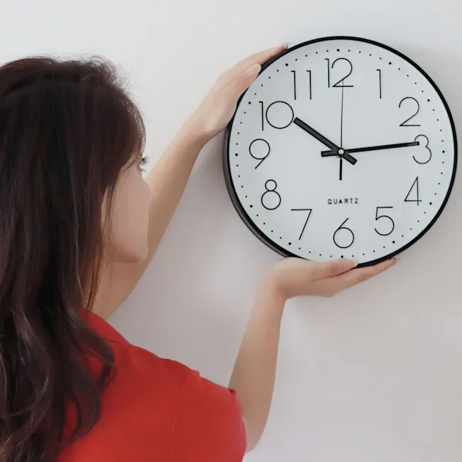 Numbera Wall Clock - White - 3 - woman holding wall clock, clock on white wall, digital clock, modern clock design, round