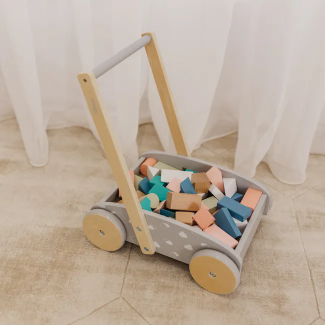 Bubble Wooden Baby Push Cart with 45 Buiding Blocks - 2 - Wooden toy cart filled with colorful wooden blocks, placed on a