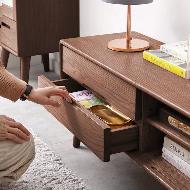 Beau TV Console 2m - Walnut - 2 - Wooden side table, drawer opening, person's hand, beige sweater, gold watch, book "Real