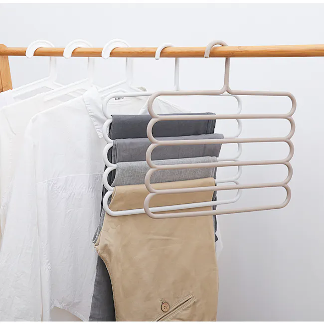 Multi Hanger - White - 4 - White clothing rack, neatly organized clothes, beige pants, gray pants, white shirt, folded