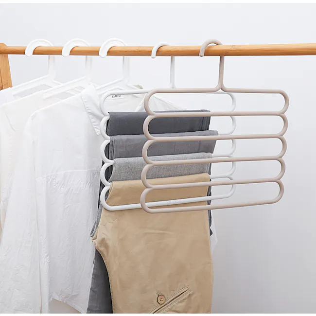Multi Hanger - White - 4 - White clothing rack, neatly organized clothes, beige pants, gray pants, white shirt, folded