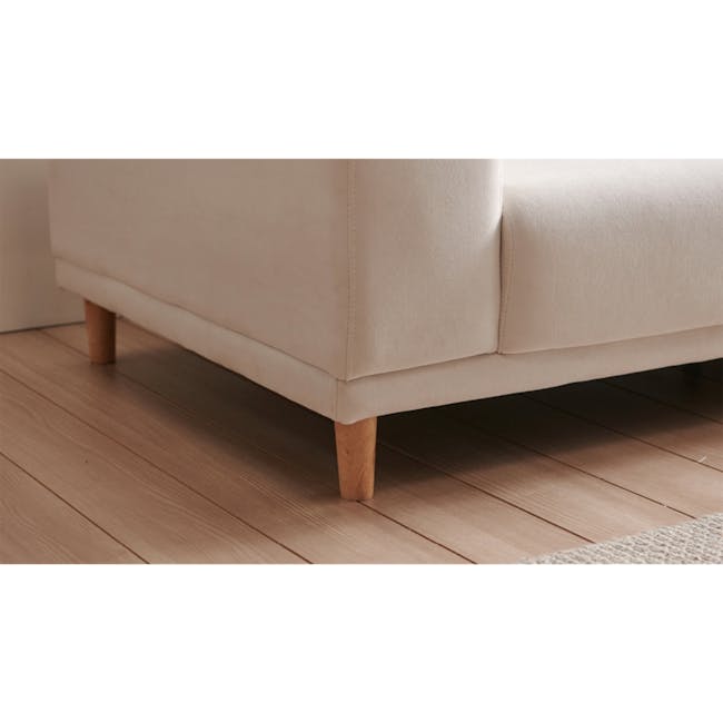 Melysa Ottoman - Ivory (Eco Clean Fabric) - 5 - Cream sofa with wooden legs, light wooden floor, minimalist design, soft
