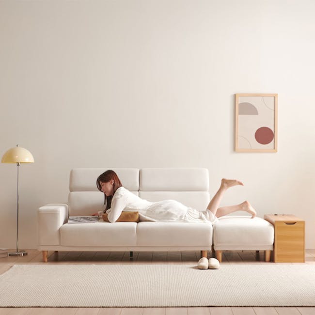 Melysa Ottoman - Ivory (Eco Clean Fabric) - 4 - White modern living room, minimalist decor, cozy sofa, woman reading, white