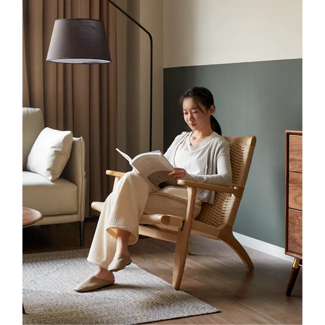Gretta Rattan Lounge Chair - Natural - 2 - Light brown curtains, modern lamp, beige armchair, light-colored pillows, wooden