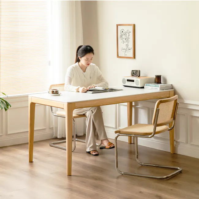 Adelyn Dining Table 1.4m (Sintered Stone) with 4 Niel Chairs in Oak - 16 - Light streaming through blinds, woman reading