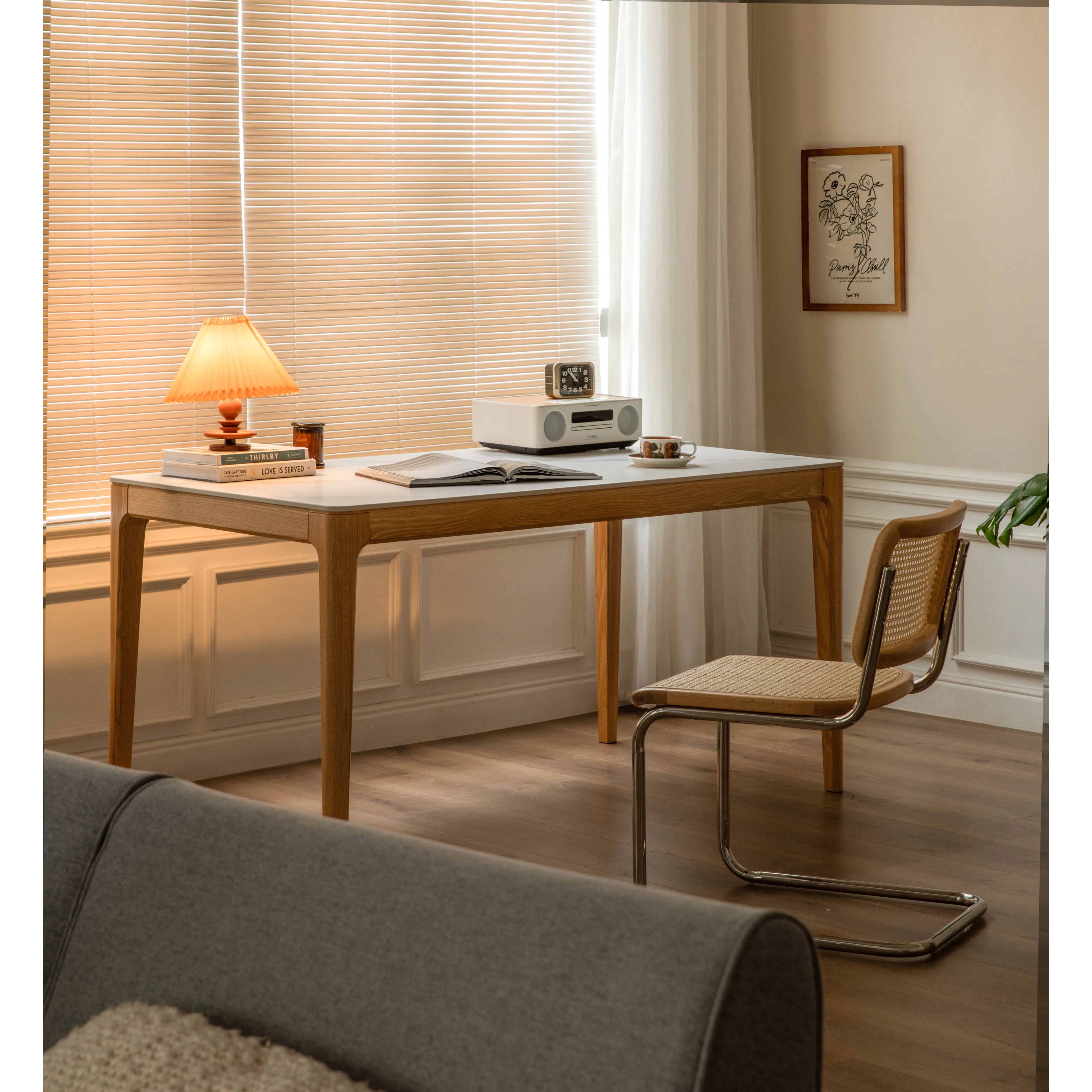 Adelyn Dining Table 1.4m (Sintered Stone) with 4 Niel Chairs in Oak - 21 - Wooden desk with open book, clock, radio, and cup