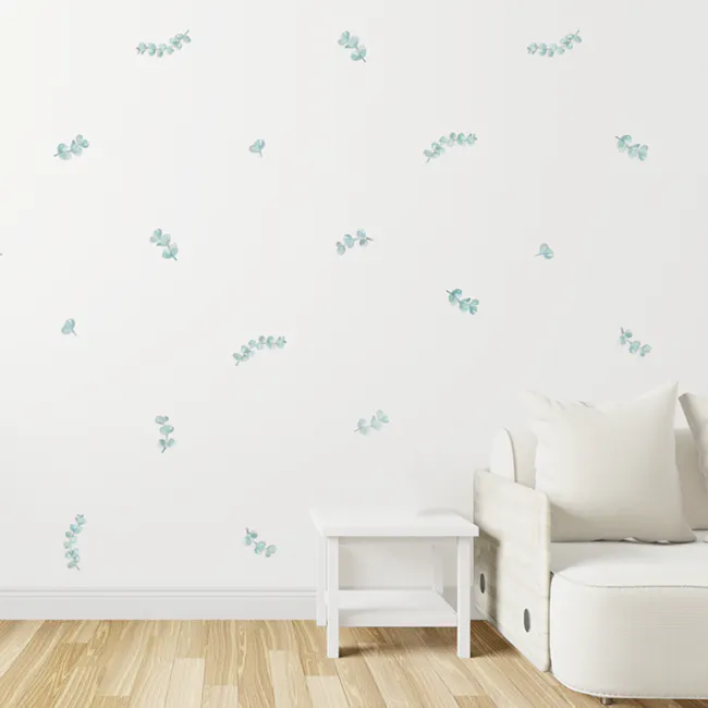 Urban Li'l Eucalyptus Fabric Decal - 1 - White wall adorned with delicate blue floral decals, light wooden floor, modern