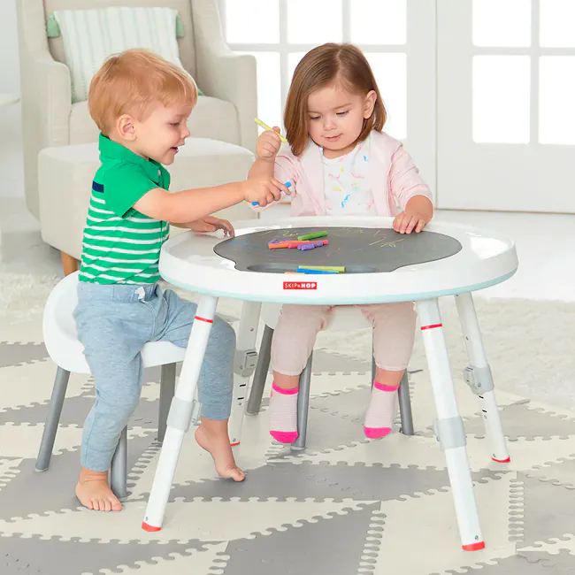 Skip Hop Activity Center - Silver Lining Cloud 3 Stage - 2 - Green striped shirt, toddler, white armchair, light blue pants