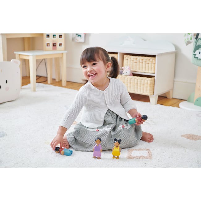 Tender Leaf Bunny Storage Unit - 3 - White, smiling, young child, sitting on carpet, holding toy, colorful dolls, white