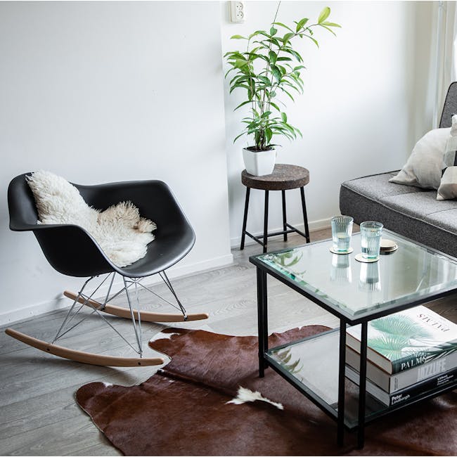 Klaus Rocking Chair - Black - 2 - black modern lounge chair, white fluffy throw, wooden slatted floor, brown fur rug, glass