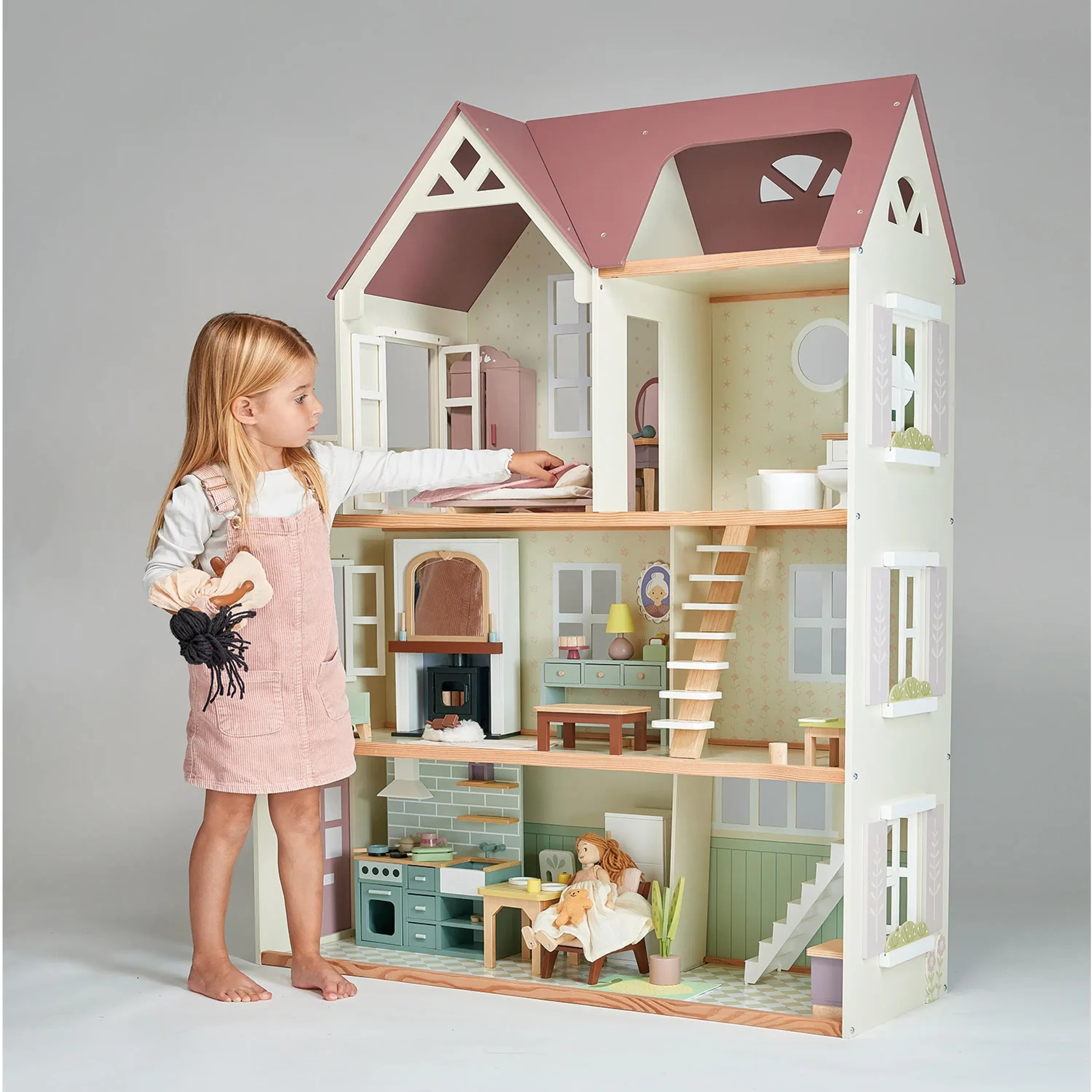Tender Leaf Mulberry Mansions - 12 - dollhouse, doll, girl, standing, pink overalls, white shirt, wooden floor, toy kitchen