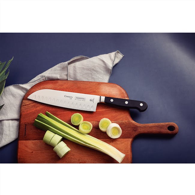 Tramontina Century 7" Cook's Knife - 4 - wooden cutting board, celery stalks, green celery, sliced celery, knife handle