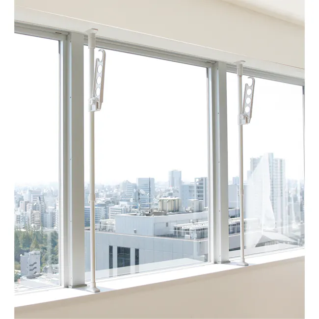 HEIAN Laundry Pole Holder Stand - 3 - Large windows, modern design, urban cityscape, clear sky, natural light, tall