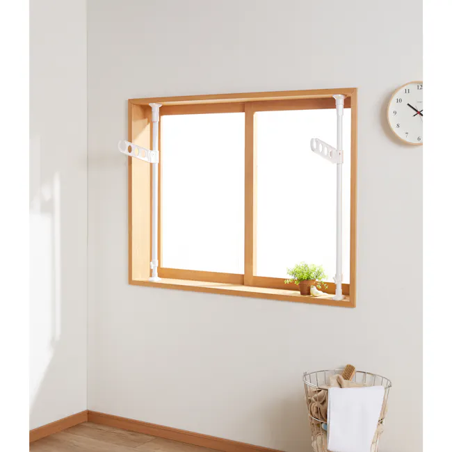 HEIAN Laundry Pole Holder Stand - 6 - White wall, wooden trim, bright window, white frame, light fixture, potted plant