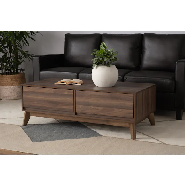 Herschel Coffee Table - Walnut - 2 - Dark leather sofa, modern coffee table, open book, white vase with green plant, indoor