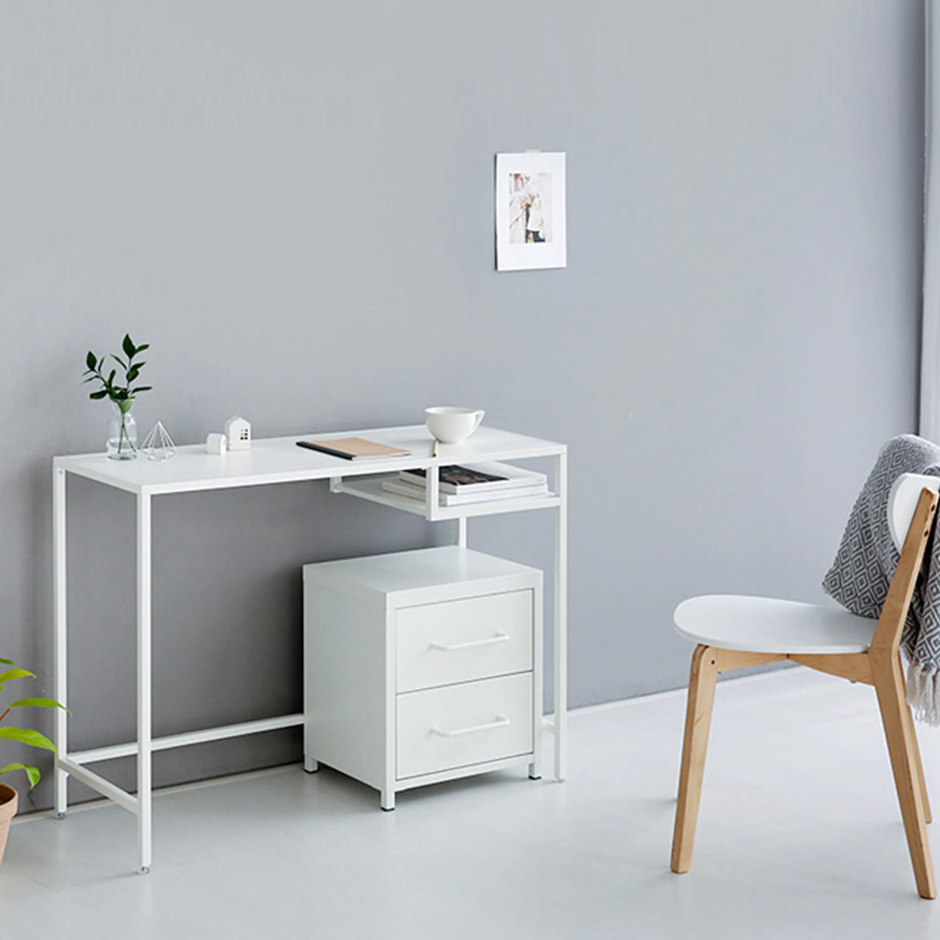 Temdo Study Table 1m - 12 - White minimalist desk with modern decor, gray wall background, small potted plant on left, white