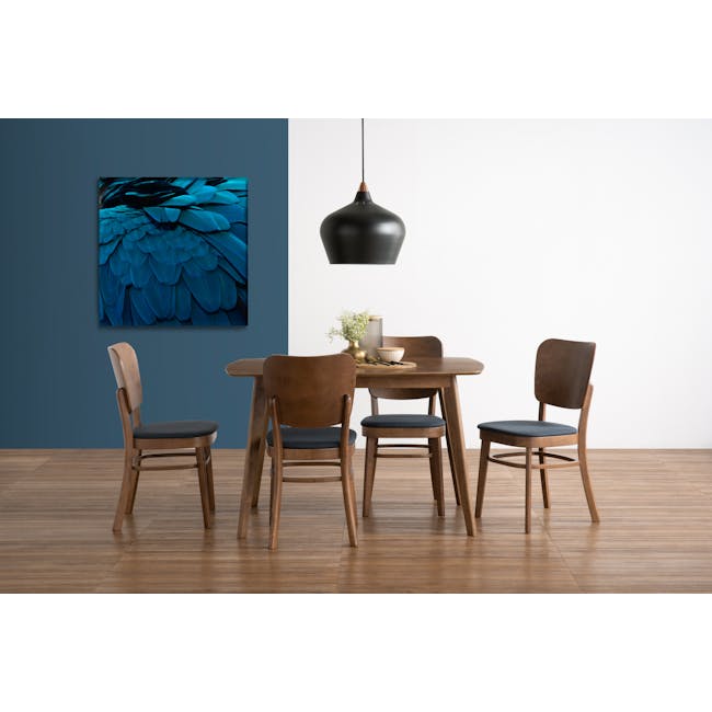 Harold Dining Table 1.2m - Cocoa - 2 - Modern dining room with wooden chairs and tables, blue feather artwork on the wall