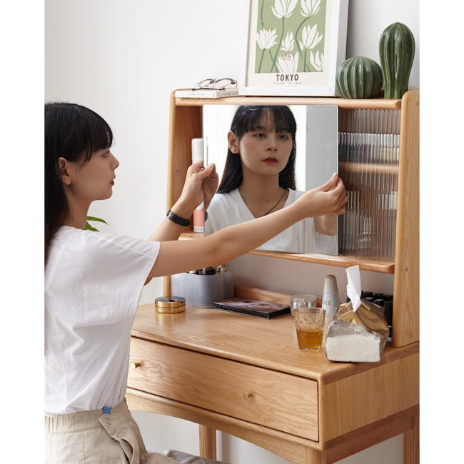 Zoie Dressing Table 0.55m - 21 - Mirror, woman, sitting, looking at reflection, glasses, white shirt, beige pants, wooden