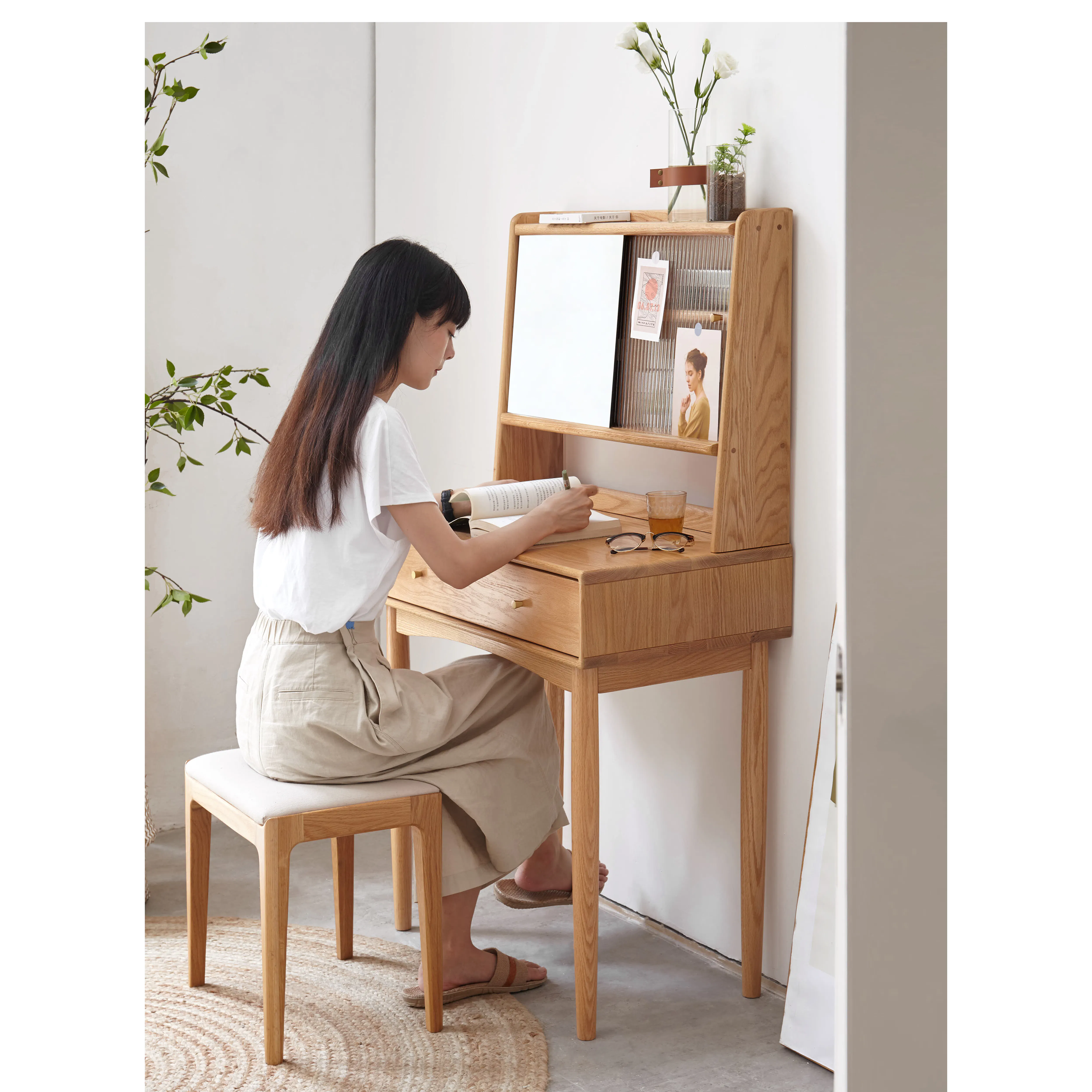 Zoie Dressing Table 0.55m - 15 - Minimalist room, woman sitting, white wall, wooden desk, natural light, green leaves, white