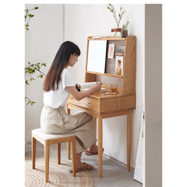 Zoie Dressing Table 0.55m - 15 - Minimalist room, woman sitting, white wall, wooden desk, natural light, green leaves, white
