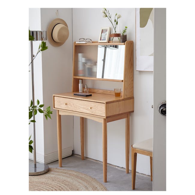 Zoie Dressing Table 0.55m - 17 - Light wood vanity with glass top, beige wall, white wall mirror, wooden frame, glass vase