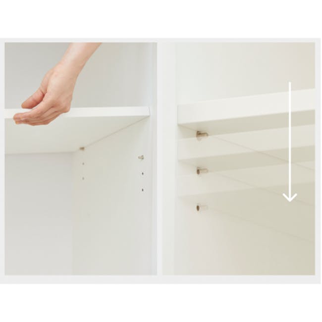 Benson Tall Cabinet 0.8m - 3 - White minimalist shelves, hand placing item, white wall, simple design, clean lines, modern