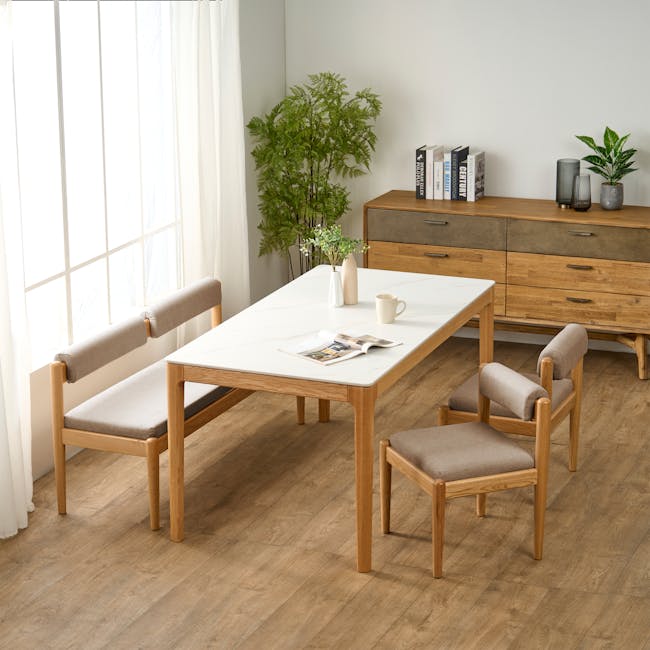 Niel Bench 1.25m - Oak, Chestnut - 2 - Light wood dining table, light brown wooden chairs, natural light streaming through