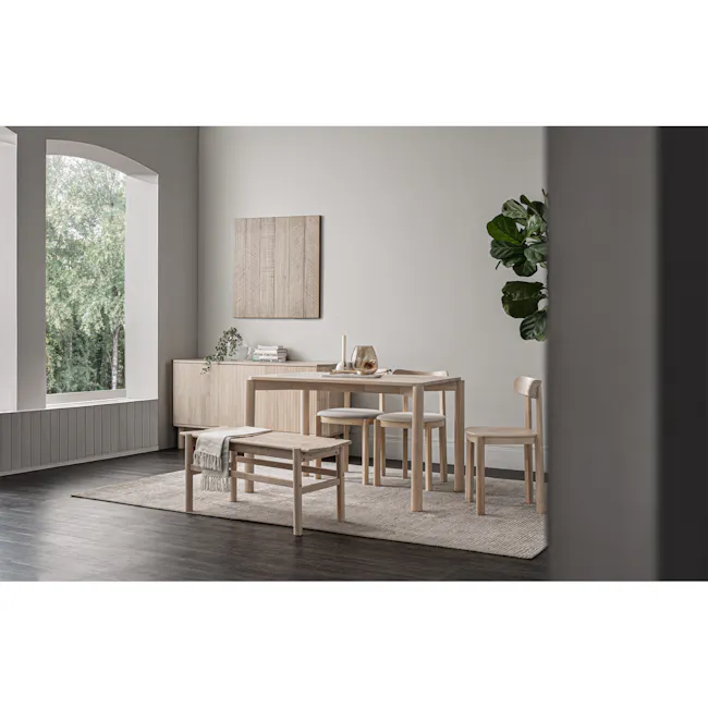 Claire Chair - 5 - Minimalist dining room, natural light streaming, large window, light-colored walls, wooden furniture