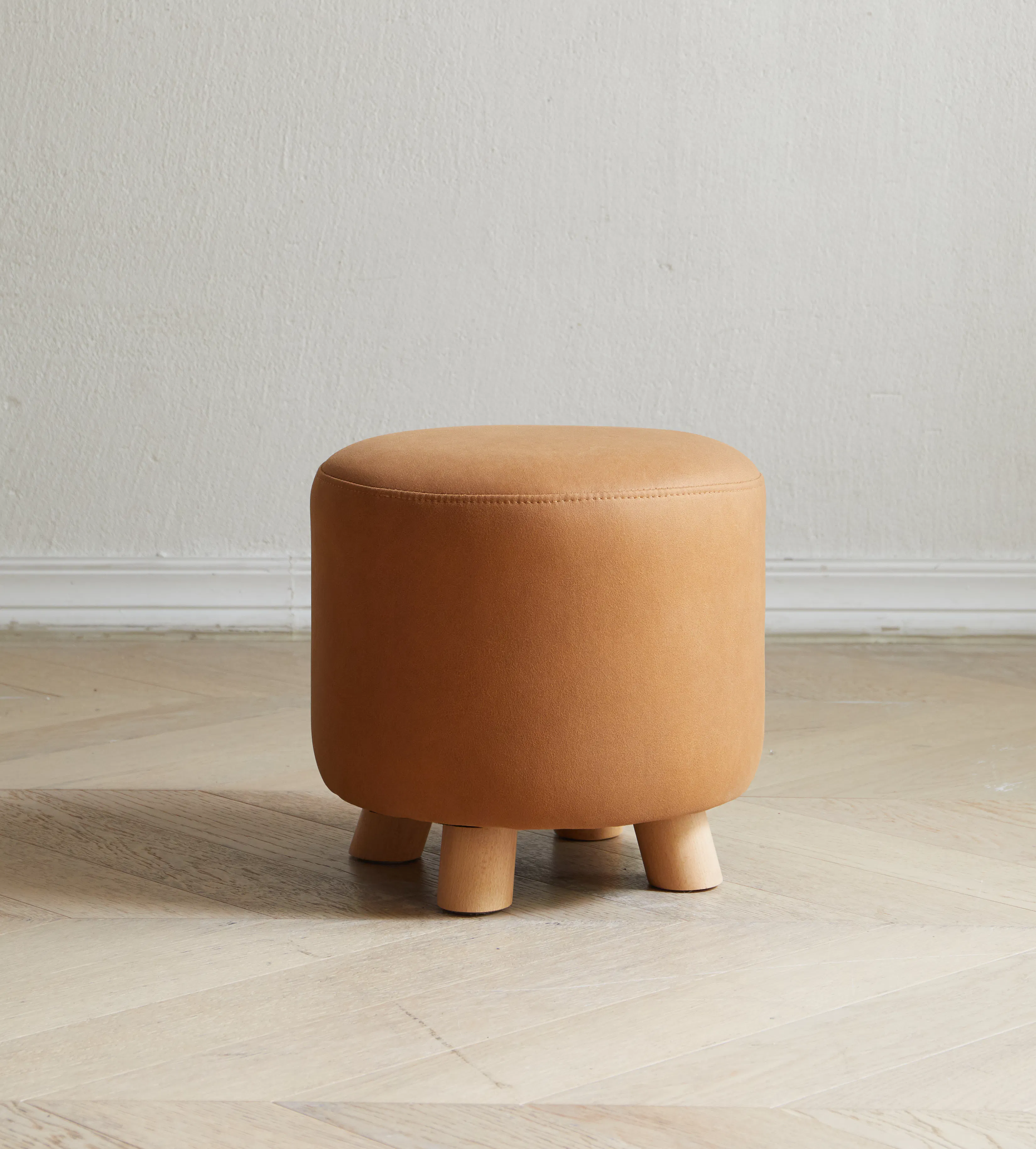 Niyo Stool - Tan - 12 - Round, brown, cushioned stool, minimalist design, wooden legs, light wood floor, simple decor, cozy
