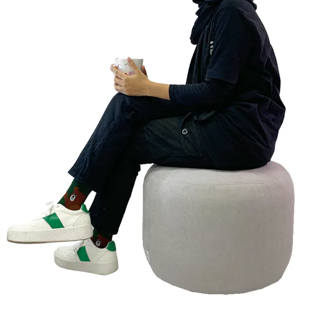 March Ottoman - Dark Brown - 5 - black hoodie, black pants, green and white sneakers, white mug, brown bear socks, gray