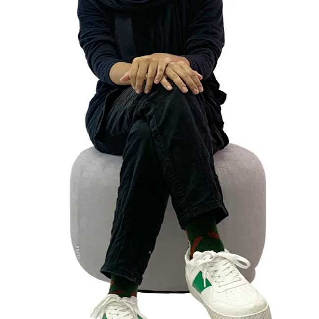 March Ottoman - Dark Brown - 6 - hoodie, black pants, green socks, white sneakers, casual attire, relaxed pose, indoor