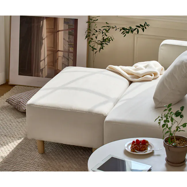 Genevieve 2 Seater Chaise Sofa with Ottoman - Ivory (Pet Friendly) - 4 - Cream-colored sofa, cozy living room, natural light