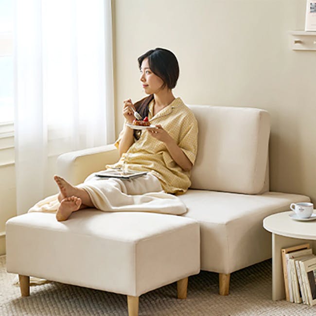 Genevieve 2 Seater Chaise Sofa with Ottoman - Ivory (Pet Friendly) - 3 - Sleek white armchair, cozy interior, soft natural