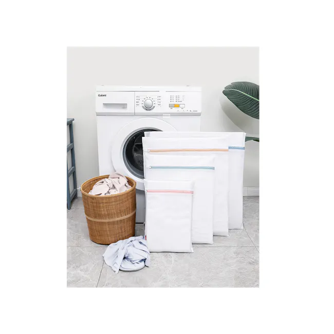 ESSENTIALS Laundry Bag - Bundle of 4 (Coarse Mesh) - 2 - Washing machine, laundry basket, white fabric, folded clothes