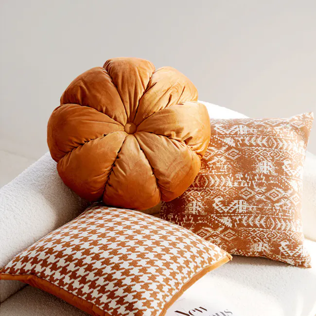 Velvet Petal Round Cushion - Rust - 4 - Orange cushion, textured fabric, cozy seating, modern decor, warm lighting, abstract