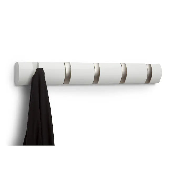 Flip 5 Hook - White - 4 - White cylindrical object with gold accents, black fabric draped over it, minimalist background