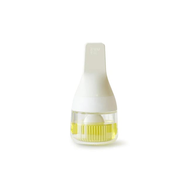 Zuutii Oil Dispenser with Brush - Light Cream - 1 - Sleek, modern bottle design, Transparent liquid inside, Yellow liquid