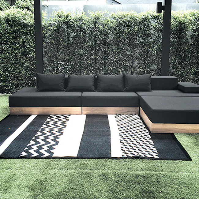 PDM Katve Reversible Mat - Black/White (3 Sizes) - 2 - Black and white geometric patterned rug on green lawn, Black and