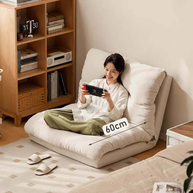 Jesse Sofa Bed - Cream Corduroy - 5 - Luxurious cushion, comfortable seating, woman playing Nintendo, 60cm height, modern