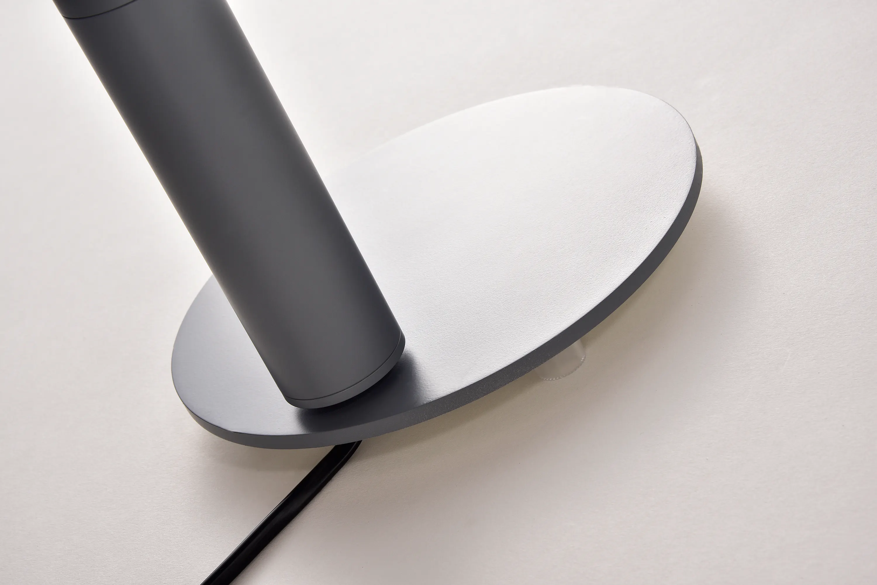 Hilda Table Lamp - Grey - 10 - Modern minimalist desk, sleek cylindrical object, black and gray design, abstract art piece