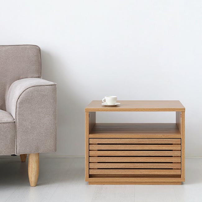 Sholid Bedside Table - 3 - Cream upholstered armchair, light wooden coffee table, minimalist design, light hardwood floor