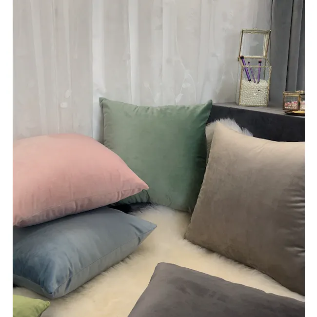 Alyssa Velvet Cushion Cover - Jade - 3 - Soft pastel pillows in shades of pink, green, blue, and gray, stacked on a fluffy