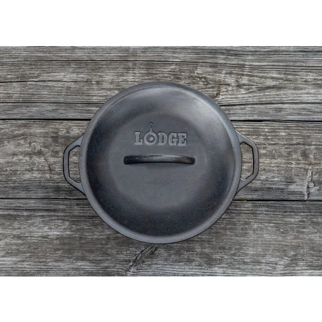 Lodge Seasoned Cast Iron Dutch Oven (2 Sizes) - 7 - Lodged cast iron skillet, rustic wooden background, textured surface