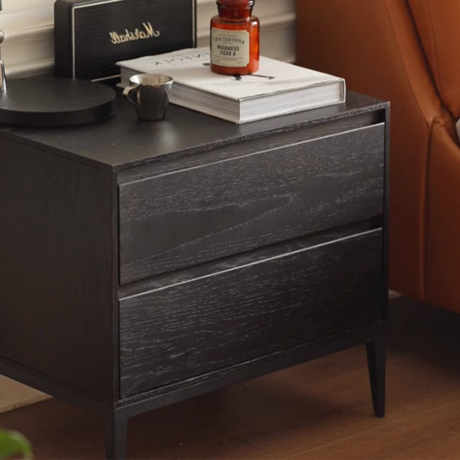 Noir Bedside Table - 3 - Dark wood nightstand, black finish, minimalist design, side table, leather armrest, stack of books