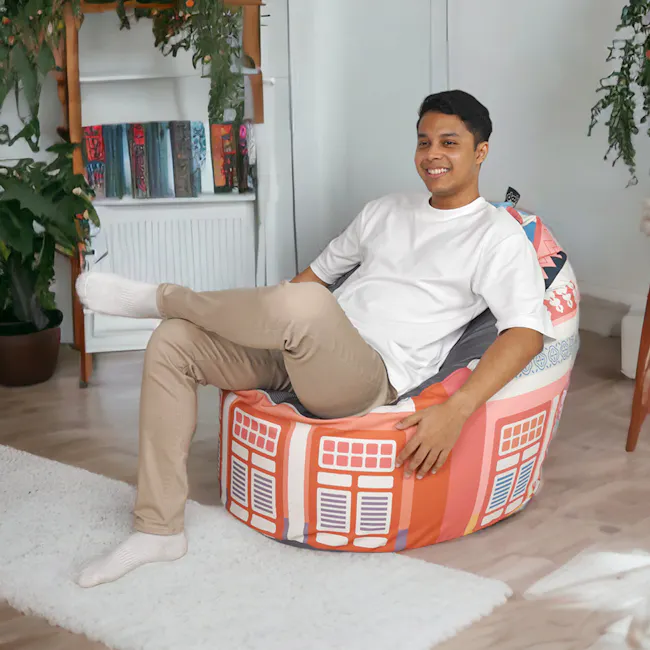 Doob Oomph - Herritage Collection - Shophouses - 2 - white shirt, beige pants, colorful cushion, white socks, indoor