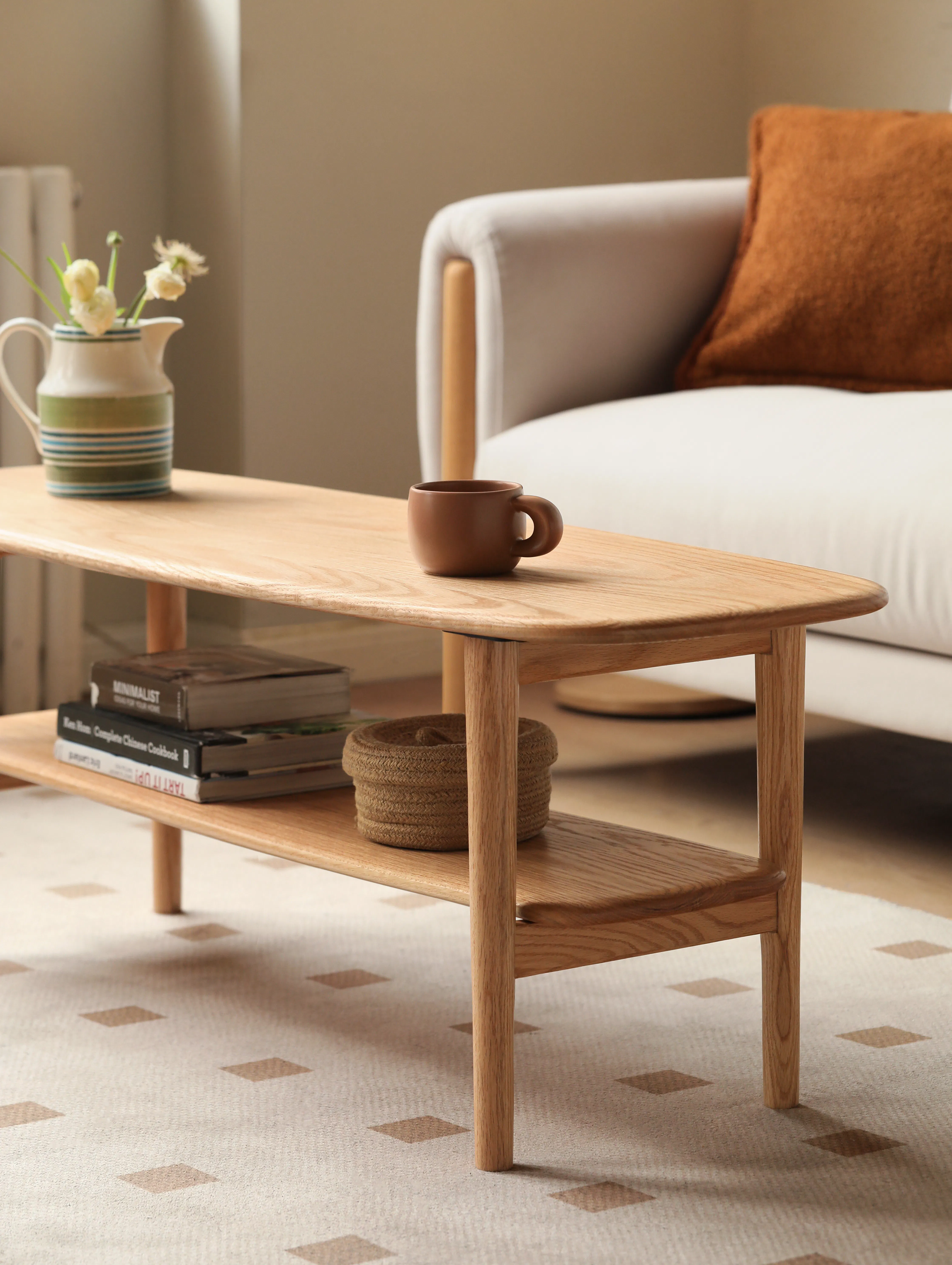 Nigel Narrow Coffee Table 1m - 11 - Wooden coffee table, beige carpet, geometric pattern, wooden legs, light brown wood