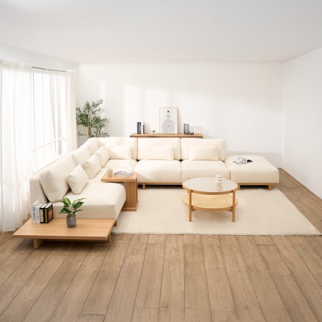 Miu Large Corner Extended Lounge Sofa - 3 - Minimalist living room with white walls and wooden flooring, featuring a large