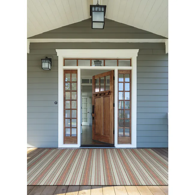 Marbella Flatwoven Rug - Coral Ivory Pewter (3 Sizes) - 2 - Wooden door entrance, gray siding, black lanterns, wooden frame
