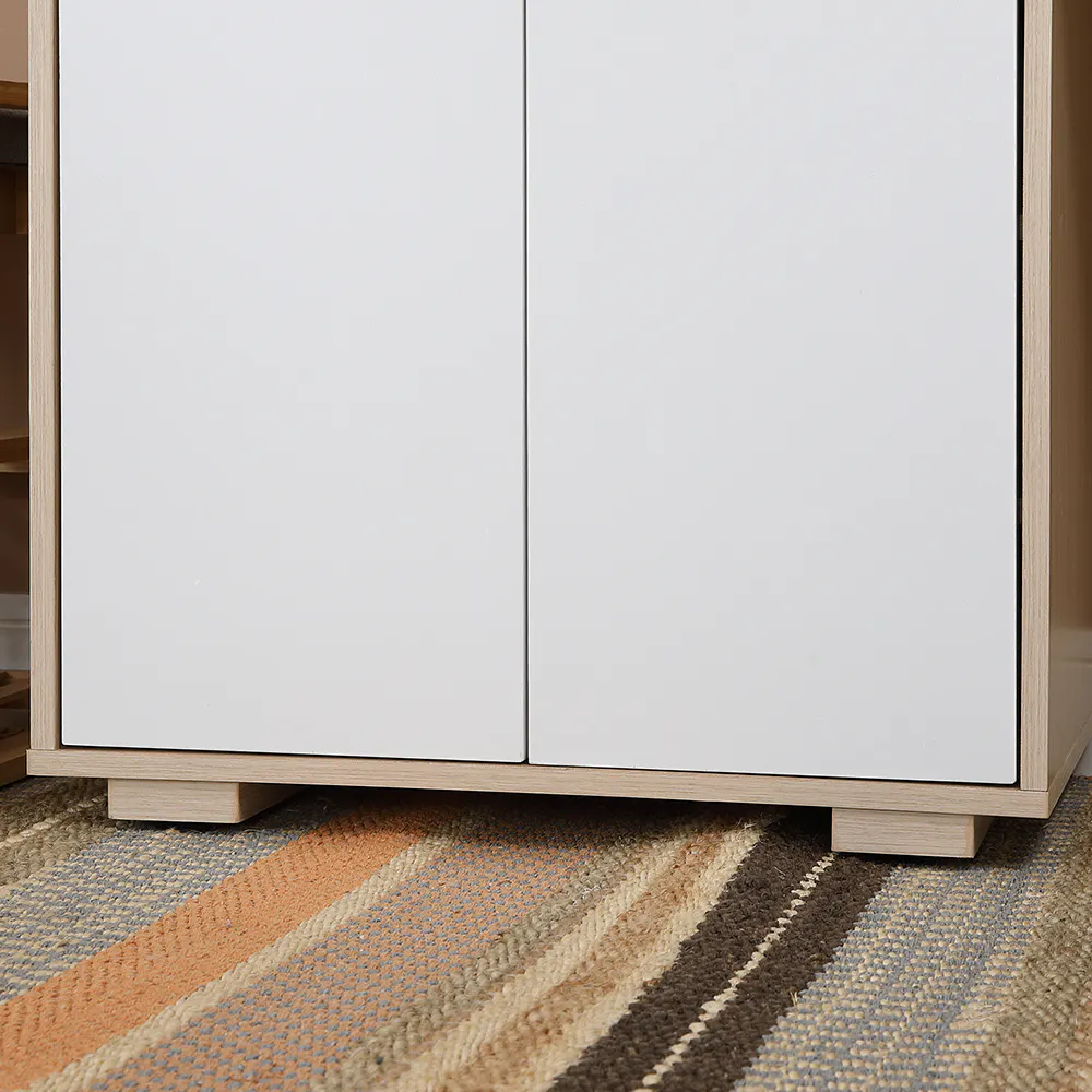 Maren Shoe Cabinet - 10 - White cabinet with wooden legs, minimalist design, open doors, light wood finish, rectangular