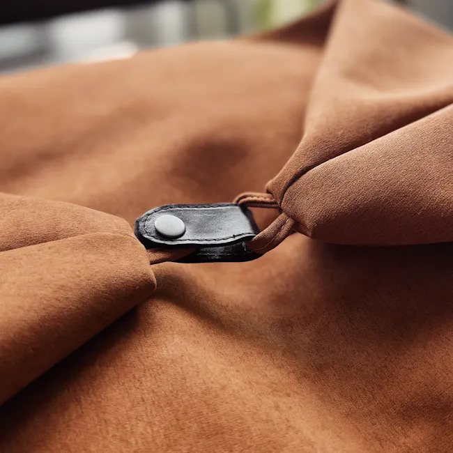 Magic 3-in-1 Bean Bag - Light Grey - 7 - Brown fabric, leather strap, button, fabric texture, close-up view, brown suede